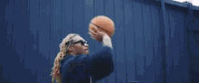 a blurry picture of a person playing basketball in a hoop .