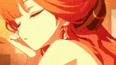 a girl with red hair is wearing earrings