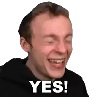 a man is laughing with his eyes closed and the word yes is on his face .