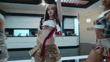 a woman in a plaid skirt is dancing in a room