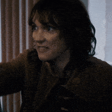 a close up of a woman making a funny face
