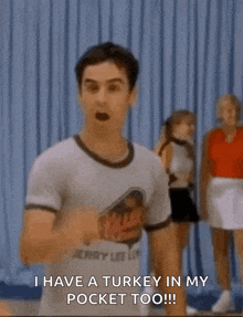 a man wearing a t-shirt that says i have a turkey in my pocket too is dancing .