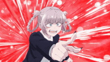a girl with pigtails is pointing with her finger