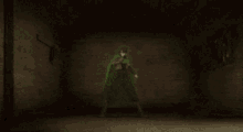 a person in a cape is standing in a dark room with a green light behind them