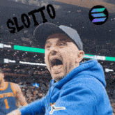 a man wearing a hat and a blue hoodie is screaming with the word lotto above him