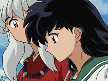 a boy and a girl are looking at something in the distance