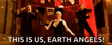 three women are dancing in front of a red curtain with the words this is us earth angels written on the bottom