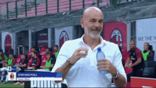 a man with the name stefano pioli written on his shirt