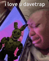 a person is crying while looking at a picture of a bunny on a screen that says i love u davetrap