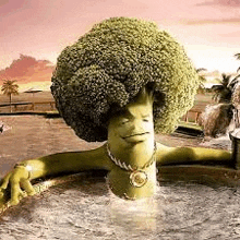 a broccoli with a big head is taking a bath in a hot tub .