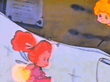 a cartoon of a girl with red hair and a bow