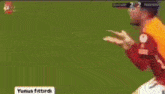 a soccer player is being tackled by another player during a match .