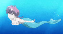 a girl with purple hair is swimming in the ocean