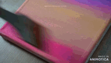 a pink and purple painting with the words made in animotica on the bottom