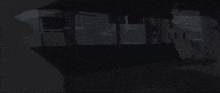 a dark background with a light coming out of the corner