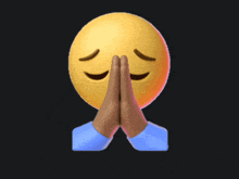 a yellow smiley face with its eyes closed and its hands folded
