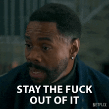 a man with a beard and earrings says stay the fuck out of it