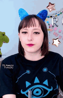 a woman wearing a shirt that says dynamite twins on it