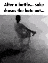 a black and white photo of a man sitting in a chair with the words after a battle sake chases the hate out