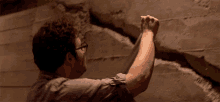 Sticking Duct Tape To A Huge Wall Crack Seth Rogen GIF