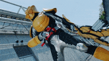 a man in a yellow and black costume with a red belt that says ' samurai ' on it