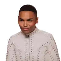 a man in a white jacket with silver studs on it