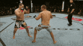 two men are fighting in a ring with a sign that says uncharted 3 in the background