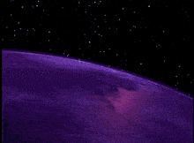 a purple planet is surrounded by stars in a dark night sky