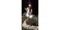 a statue of a man riding on the back of a horse