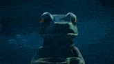 a video game character has a green object in his mouth