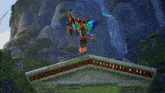 a video game character with wings is standing in front of a blue portal .