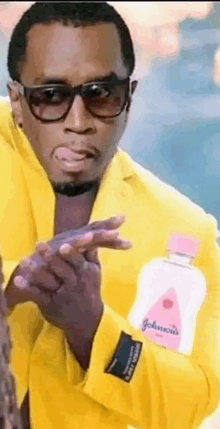 a man in a yellow jacket is holding a bottle of baby oil