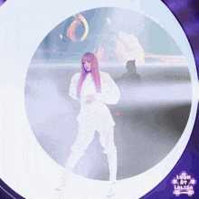 a woman in a white outfit is standing in a circle with the words look at lalisa on the bottom