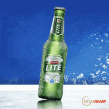 a bottle of castle lite beer is sitting on a table
