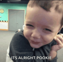 a little boy is smiling with the words " it 's alright pookie " below him