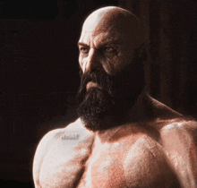 a shirtless man with a beard has the word what on his shoulder