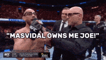 a man talking into a microphone with the words " masvidal owns me joe " on the bottom