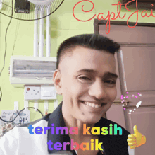 a man is smiling and giving a thumbs up with the words terima kasih terbaik below him