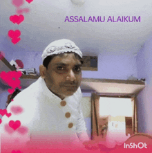 a man wearing a white hat is surrounded by pink hearts and the words assalamu alaikum above him