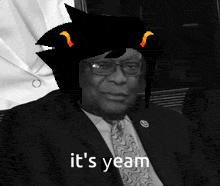 a man in a suit and tie with a cat on his head and the words it 's yeam