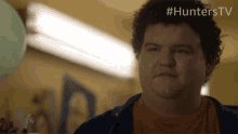 a close up of a man 's face with #hunterstv on the bottom