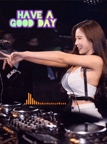 a woman behind a dj mixer with the words have a good day above her