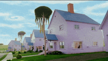 a row of purple houses with blue roofs and trees in front of them