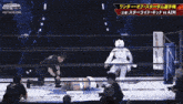 a wrestling match between azm and stardom with a referee