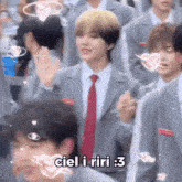 a man in a suit and tie stands in a crowd with the words ciel i riri 3 written on the bottom
