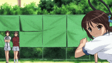 a girl holding a tennis racquet on a court