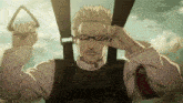 a man wearing sunglasses is holding a handle