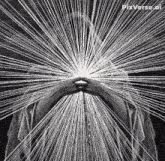 a black and white drawing of a person with a light coming out of their face .