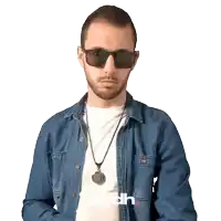 a man wearing sunglasses and a denim shirt with the word mcdh on the bottom