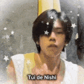 a close up of a person 's face with the words tui de nishi written on the bottom